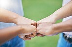 People, hands and fist bump for community, trust or collaboration in partnership together in the outdoors. Hand of team bumping fists in unity for agreement, coordination or support in solidarity