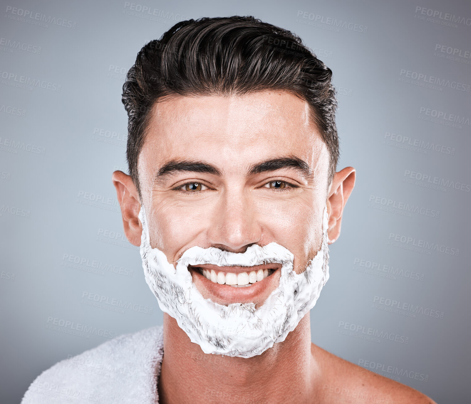 Buy stock photo Grooming, shaving and portrait of a man with cream on face isolated on a grey studio background. Happy, hygiene and headshot of a person with a facial product for beard hair removal on a backdrop