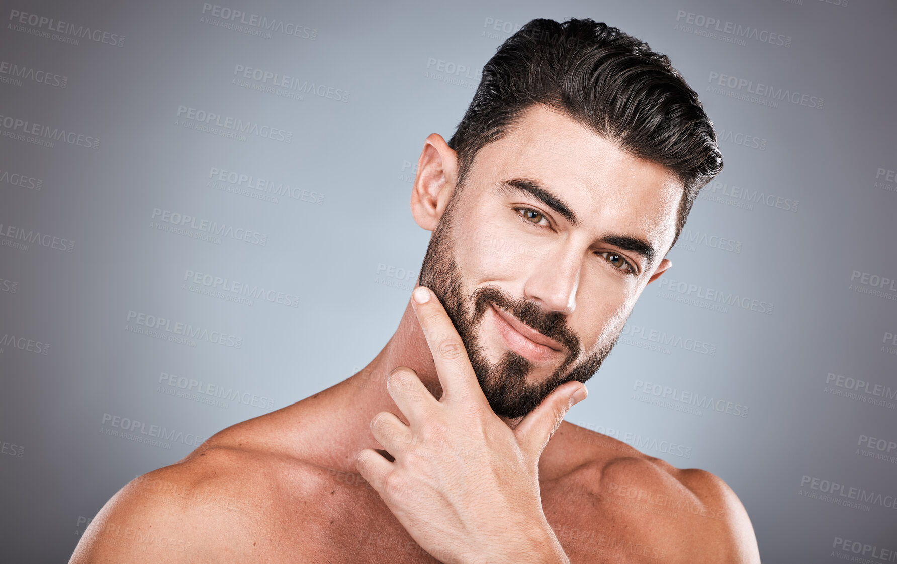 Buy stock photo Skincare, face and confidence, portrait of man with smile, hands on facial hair or beard maintenance. Fitness, health and spa facial care, male model with muscle in studio isolated on grey background