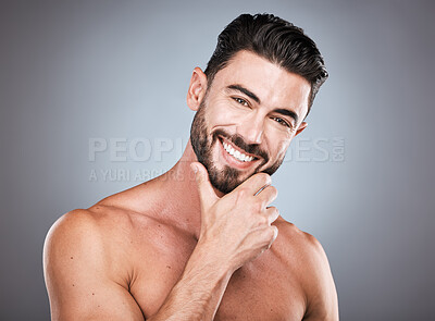 Buy stock photo Skincare, beauty and smile, portrait of man with hand on face and hair or beard maintenance. Fitness, health and spa facial care, happy male model with muscle in studio isolated on grey background.