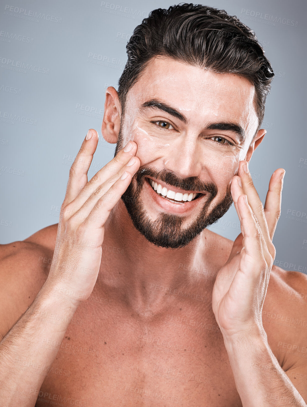 Buy stock photo Portrait, skincare and man with cream in studio isolated on a gray background for facial wellness. Face, dermatology cosmetics or happy male model with lotion, creme or moisturizer product for health