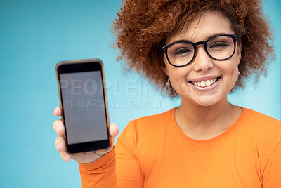 Buy stock photo Phone screen, mockup and black woman isolated on blue background mobile app, social media or product placement. Portrait student, person or youth show smartphone for website or tech mock up in studio