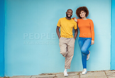 Buy stock photo Interracial, portrait and couple on a city wall for travel, holiday and happy in Germany. Smile, relax and black man and woman standing on a mockup background downtown during a vacation together