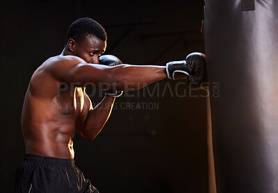 Buy stock photo Boxing, fitness and black man isolated on a dark background or gym training and bodybuilder fist impact. Strong, power and focus of boxer, athlete or sports person with exercise, workout in mma gear