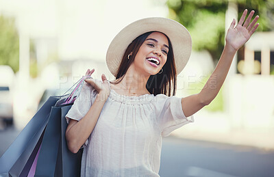 Buy stock photo Woman, shopping bags and hand signal in the city waiting on the street for transport, lift or travel. Happy female shopper waving hands carrying gifts in discount, deal or sale for traveling in town