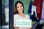 Business owner, holding and portrait of a woman with a sign for a closed shop in the afternoon. Smile, entrepreneur and retail employee showing a board for a store closure, advertising and news