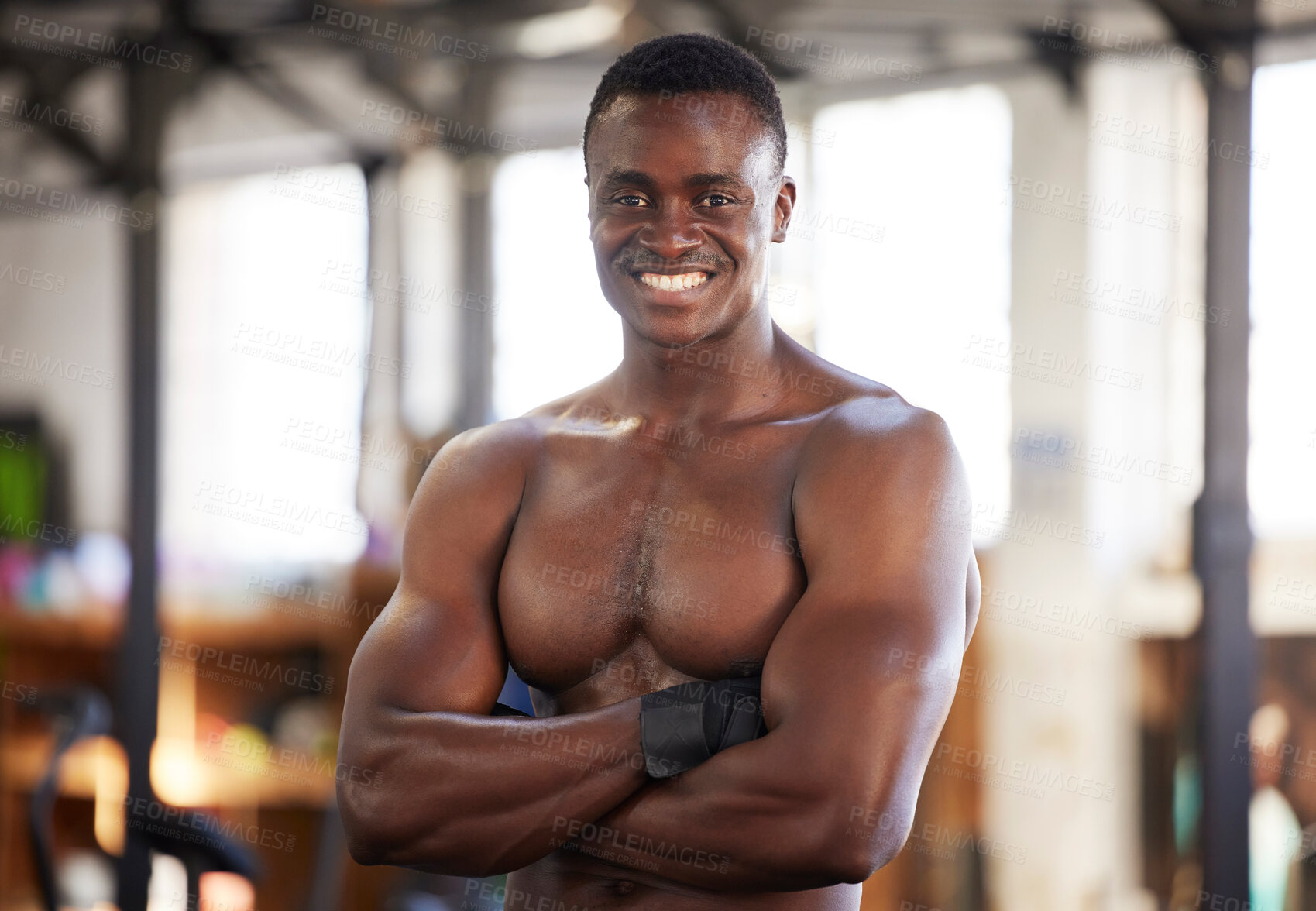 Buy stock photo Happy, fitness and portrait of man at gym proud, smile and relax with empowered, mindset and blurred background. Face, bodybuilder and positivity by black guy training, workout and exercise routine