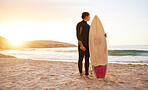 Surfer, surf and man with surfboard at the beach, sea and ocean in sunset or the morning with mockup space. Young, ready and male in swimsuit on a sunny day on the sand, shore and water in summer