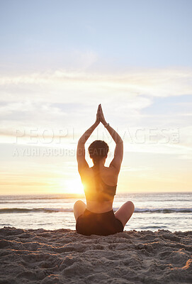 Buy stock photo Woman, yoga and meditation on the beach for spiritual wellness or zen workout during sunset. Female yogi relaxing and meditating in sunrise for calm, peaceful mind or awareness by the ocean coast