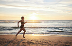 Woman, fitness and runner on the beach in sunset for healthy cardio exercise, training or workout in the outdoors. Female running or exercising in sunrise for health and wellness by the ocean coast