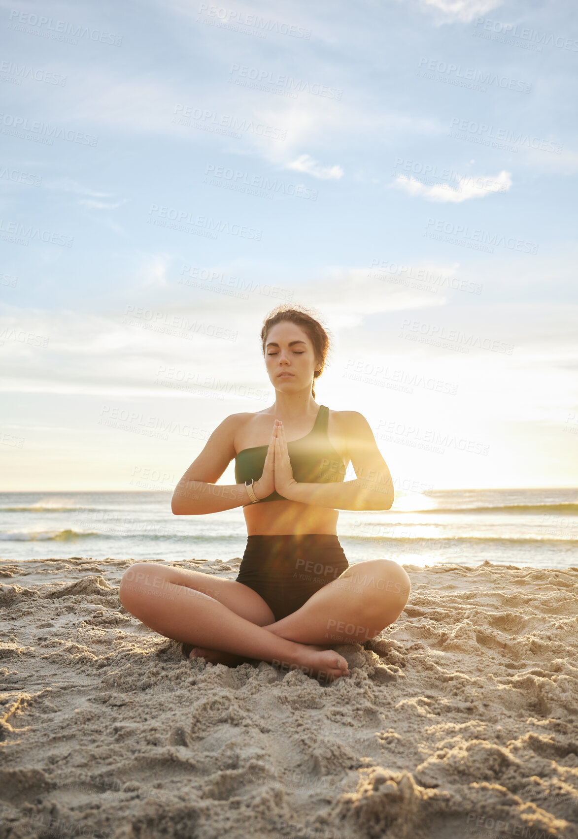 Buy stock photo Woman, yoga and meditation on the beach in namaste for spiritual wellness or zen workout in the sunset. Female yogi relaxing and meditating for calm, peaceful mind or awareness by the ocean coast