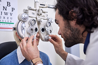 Buy stock photo Eye exam, test and patient with doctor for vision at optometry consultation for lens or frame. Woman and man in healthcare with machine for eyes with health insurance and expert ophthalmology care
