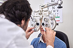 Eye care, test or exam for patient and doctor AT optometry consultation for lens or frame for vision. Woman and man healthcare person with machine for eyes, eyesight and health insurance examination