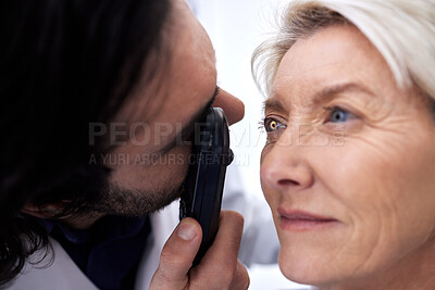 Buy stock photo Light, eye check and woman with an optician for healthcare, consultation and vision exam. Lens test, health and senior patient with a male ophthalmologist with a tool to look at visual problem