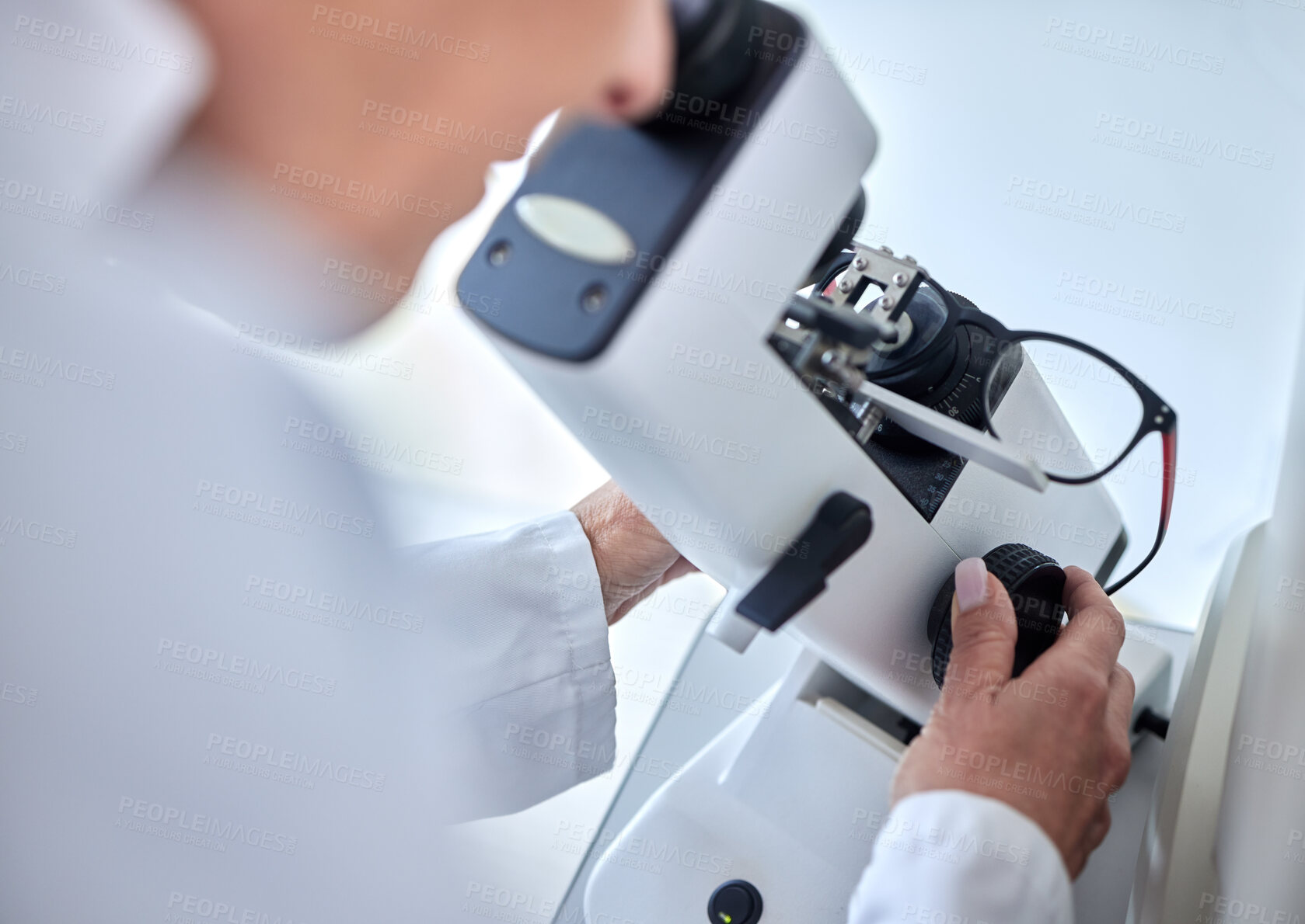 Buy stock photo Microscope, ophthalmology science and glasses with a woman doctor with tools to check lens. Medical person at work for vision and health insurance while working in  lab, store or clinic for eye care