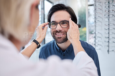 Buy stock photo Optician, glasses and face of man in store for vision, eyesight and choice of frames. Optometrist help happy customer with lenses, eye care test and healthcare consulting for retail shop services 