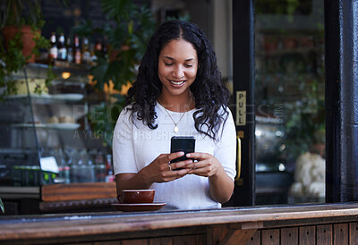 Buy stock photo Woman in coffee shop, cellphone and connection for social media, texting and online reading on break. Female, lady and smartphone for typing, communication and girl in cafe, tea and search internet