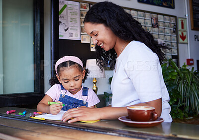 Buy stock photo Drawing, learning and girl with mother at cafe with books, studying and art education. Family care, love and mama teaching kid how to color with crayons, having fun and bonding together in restaurant