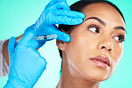 Skincare, black woman and injection for cosmetics, treatment and girl on blue studio background. Plastic surgery, African American female and confident lady with needle, blue gloves and smooth skin