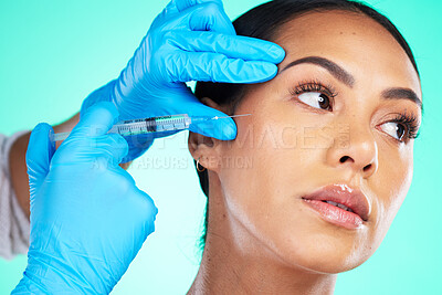 Buy stock photo Skincare, black woman and injection for cosmetics, treatment and girl on blue studio background. Plastic surgery, African American female or confident lady with needle for soft, gloves or smooth skin