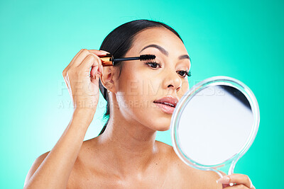 Buy stock photo Woman with mirror for beauty, mascara and face, makeup for lashes with cosmetic production. Cosmetics, healthy skin glow and brush in hand for eyelash extension, self care on studio background