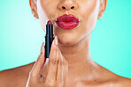 Makeup, red lipstick or beauty with a model black woman in studio on a green background for a cosmetic product. Cosmetics, mouth and lips with a female indoor to apply color for a beautiful aesthetic