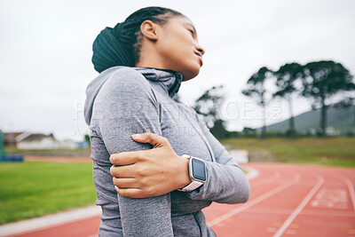 Buy stock photo Black woman, arm pain and injury after exercise, workout or training accident at stadium. Winter sports, fitness and female athlete with fibromyalgia, inflammation or painful muscles after running