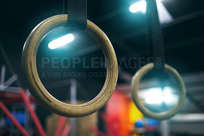 Buy stock photo Gymnastics ring, training and equipment in an empty gym for olympics preparation closeup from below. Exercise, health and interior with sports rings in a fitness center for an olympic workout