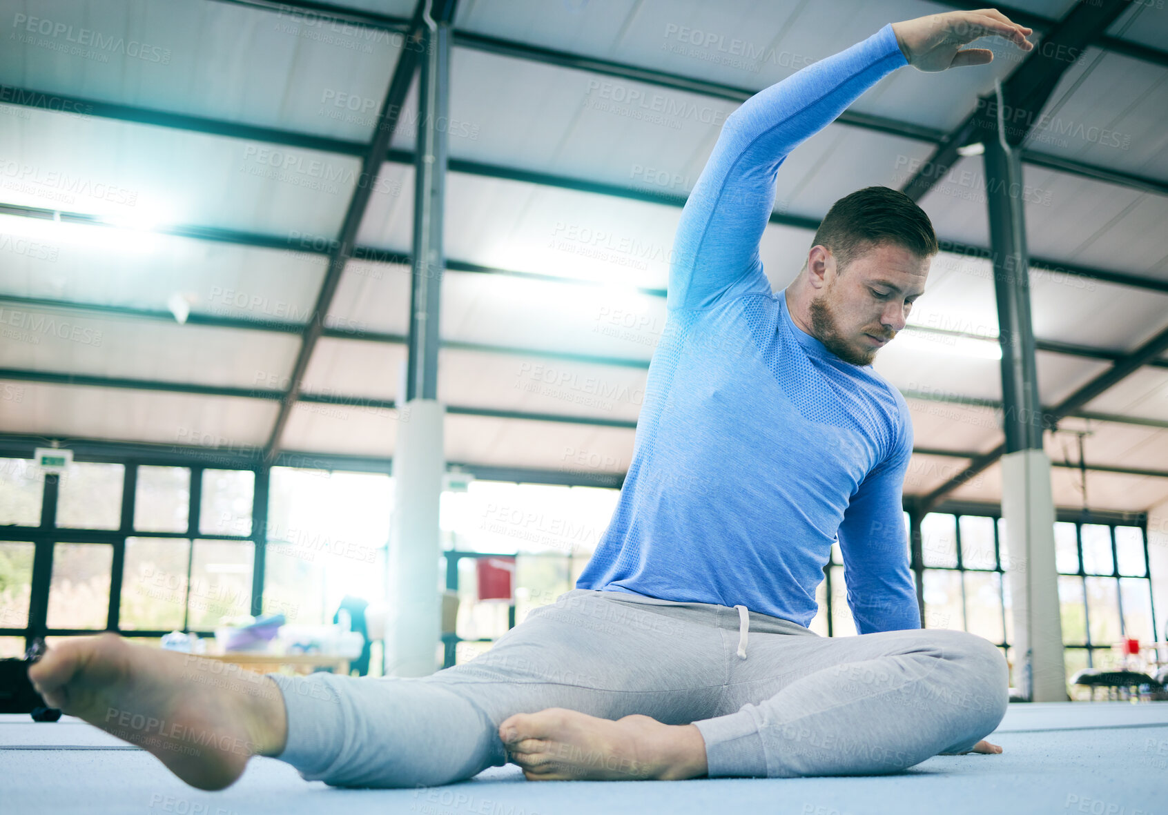 Buy stock photo Sports, gymnastics and man stretching body ready to start warm up for training, exercise and workout on floor. Fitness, motivation and male athlete with focus for balance, performance and competition