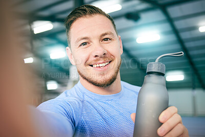 Buy stock photo Fitness, selfie and portrait of man with water bottle at gym for training, exercise and cardio on blurred background. Face, athletic and guy smile for photo while relax with drink during body workout