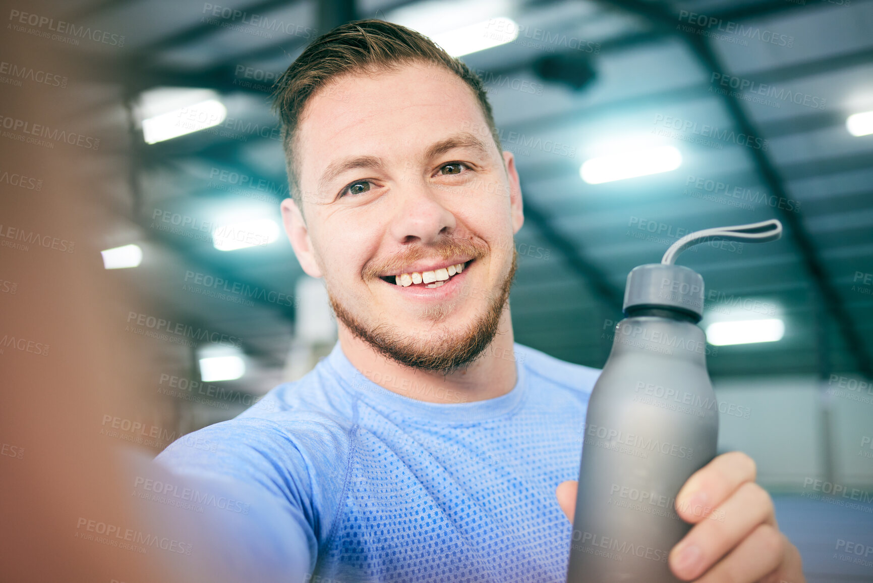 Buy stock photo Fitness, selfie and portrait of man with water bottle at gym for training, exercise and cardio on blurred background. Face, athletic and guy smile for photo while relax with drink during body workout