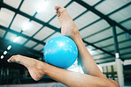 Feet, gymnastics and woman with ball for competition, practice or event training. Closeup, sports and barefoot female gymnast balance equipment with agility, exercise and performance in olympic arena