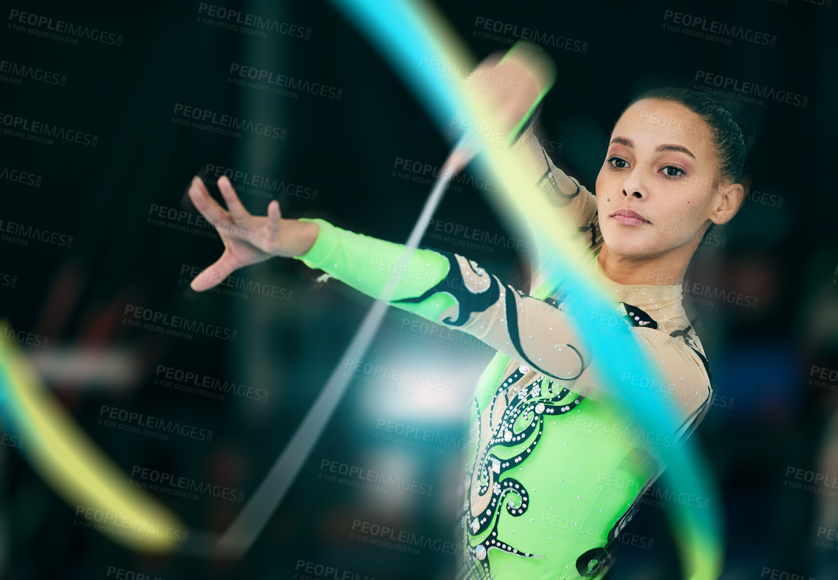 Buy stock photo Fitness, gymnastics and woman performing with a ribbon for a competition or training in sport arena. Sports, athlete and female practicing for balance, endurance and flexibility exercise for routine.