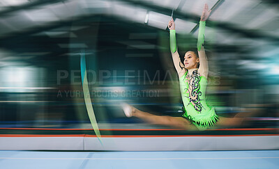 Buy stock photo Gymnastics, fitness and woman with jump and motion blur, sport in gym or arena with action and speed. Athlete, moving and mockup space with gymnast, flexibility and pose with sports and splits in air