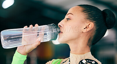 Buy stock photo Woman drinking water, bottle and gymnast in gym, competition with athlete, hydration and health with fitness. Exercise, face profile and active with gymnastics, wellness and healthy with sports