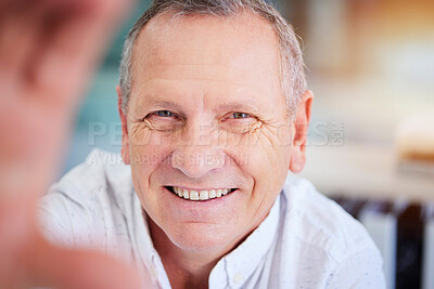 Buy stock photo Selfie, smile and business with a mature man in his office, taking a picture while working alone. Portrait, face and happy with a senior male employee smiling while posing for a photograph at work