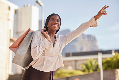 Buy stock photo Taxi, hand and sign by black woman shopping in a city, happy and smile on mockup background. Girl, hands and gesture for transportation service after retail or mall visit in town on the weekend
