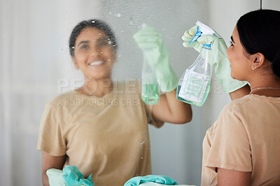 Buy stock photo Happy, woman and cleaning mirror with smile, spray bottle and soap, housekeeping in home or hotel. Housework, smudge and housekeeper or cleaner service washing dirt off glass reflection in apartment.