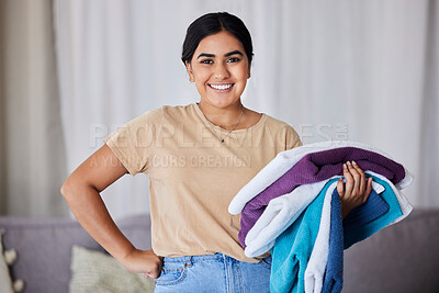 Buy stock photo Portrait, woman and laundry with hygiene, spring cleaning service and chores with smile in home. Maid, Indian female cleaner and happy lady with washed clothes, fabric and housekeeper in living room