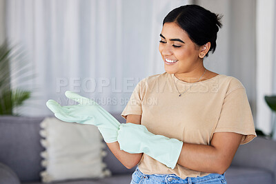 Buy stock photo Cleaning, woman and gloves on hands in home for housekeeping, maintenance and safety. Happy cleaner, housewife and smile in apartment while ready for domestic chores, services and dirt free lifestyle