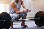 Hands, bodybuilding and powder with a woman weight lifter getting ready to exercise or workout at gym. Fitness, grip and training with a female bodybuilder weightlifting for strong muscles or health