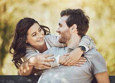 Buy stock photo Hug, love and couple on park bench, smile and having fun time together outdoors. Valentines day, romance relax and care of happy man and woman hugging, embrace and cuddle on romantic date outside.