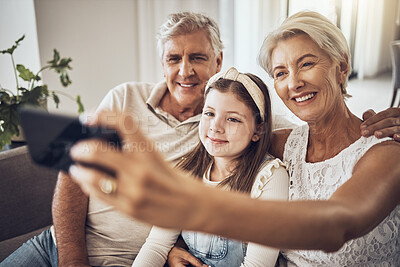 Buy stock photo Selfie, smile or happy grandparents with girl in living room bonding as a family in Australia with love. Pictures, senior or elderly man relaxing with old woman or child at home together on holiday 