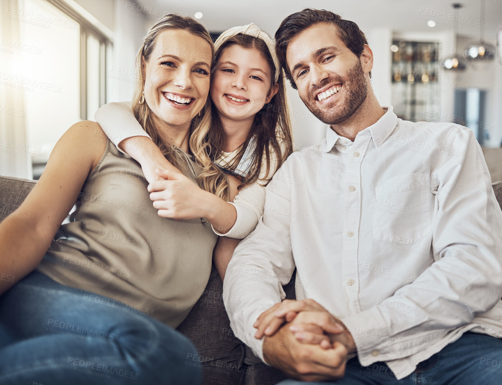 Buy stock photo Portrait, mother or father with a girl to relax as a happy family in living room bonding in Australia with love or care. Hugging, sofa or parents smile with kid enjoying quality time on a fun holiday