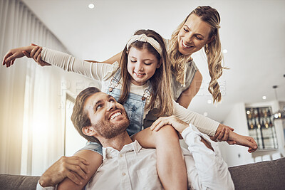 Buy stock photo Family, bonding and airplane game in living room, house or relax home in freedom activity, kids energy or fun playing. Smile, happy and flying child on father shoulders in fantasy support with mother