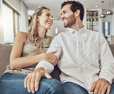 Buy stock photo Funny, care and couple on the sofa to relax with love, smile and gratitude in living room. Happiness, laughing and happy man and woman comfortable on the couch for peace, conversation and affection