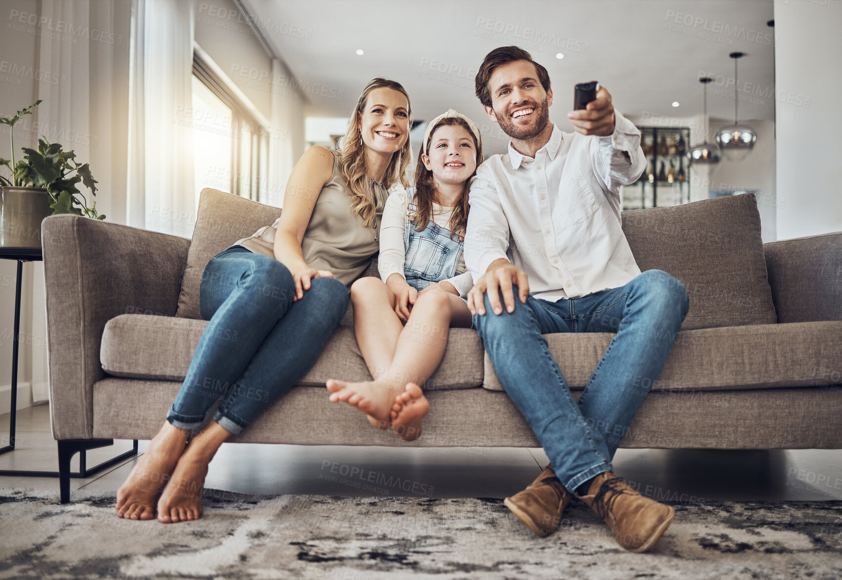 Buy stock photo Girl, mother or father watching tv to relax as a happy family in living room bonding in Australia with love. Television, sofa or parents smile with kid enjoying quality time or movies on fun holiday