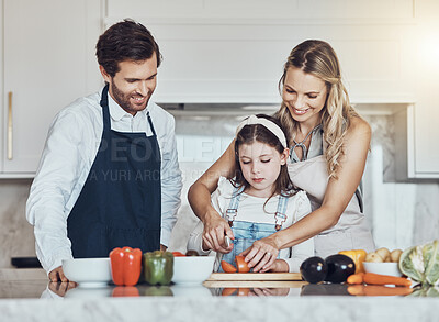 Buy stock photo Learning, parents or child cooking vegetables as a happy family in a house kitchen with organic food for dinner. Development, father or mom teaching, helping or cutting tomato with a healthy girl