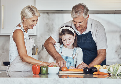 Buy stock photo Learning, grandparents or girl cooking as a happy family in a house kitchen with organic vegetables for dinner. Grandmother, old man and child helping or cutting carrots for a healthy vegan food diet