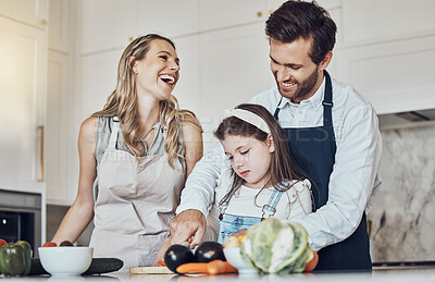 Buy stock photo Learning, happy family or girl cooking or cutting vegetables in a kitchen with healthy food for dinner. Development, father or funny mother laughing, teaching or helping a kid or child in a meal